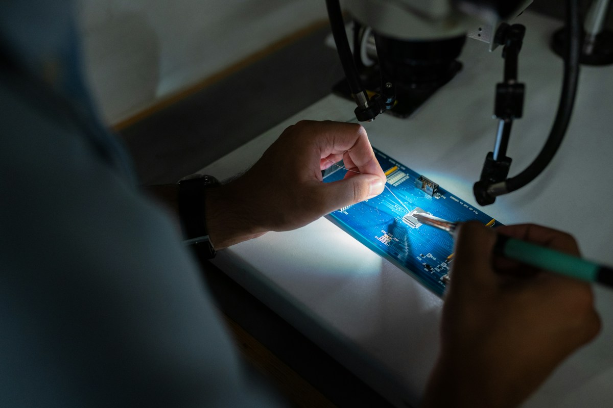 Industrial technician working with mechanical equipment